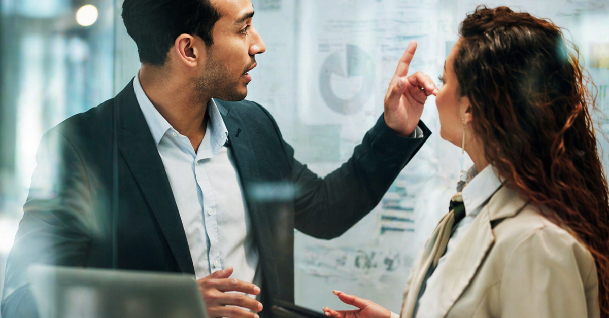 Business professionals discussing strategy and data insights using affordable technology in a modern office setting
